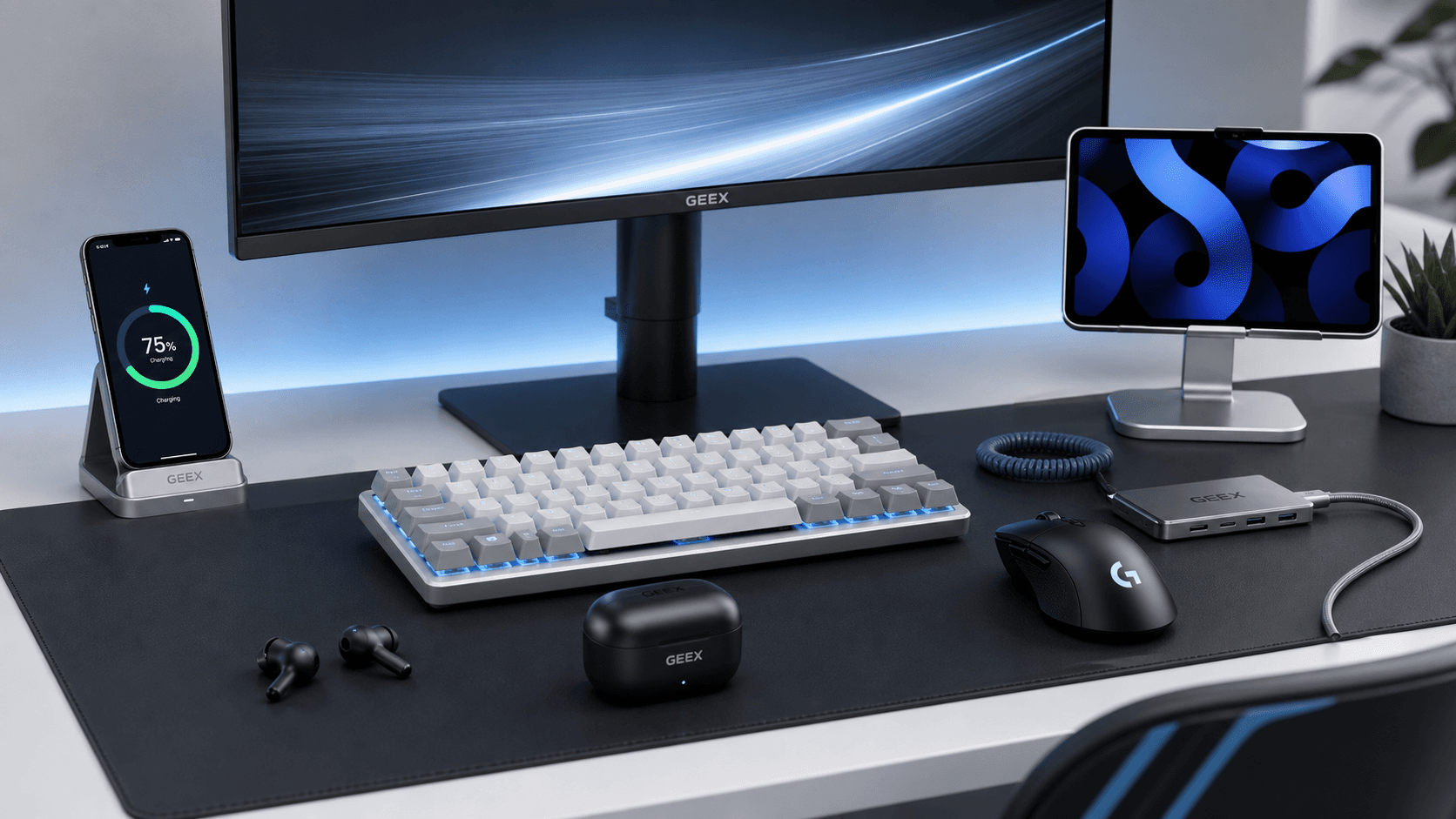 GEEX desk setup with keyboard, mouse, earbuds, phone stand, tablet, and charging accessories